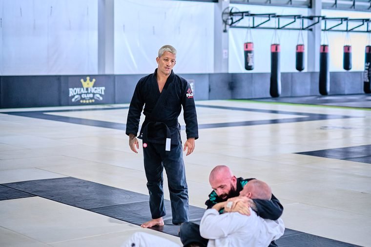 BJJ coach watching a pair roll during class at Superpro Samui, Koh Samui