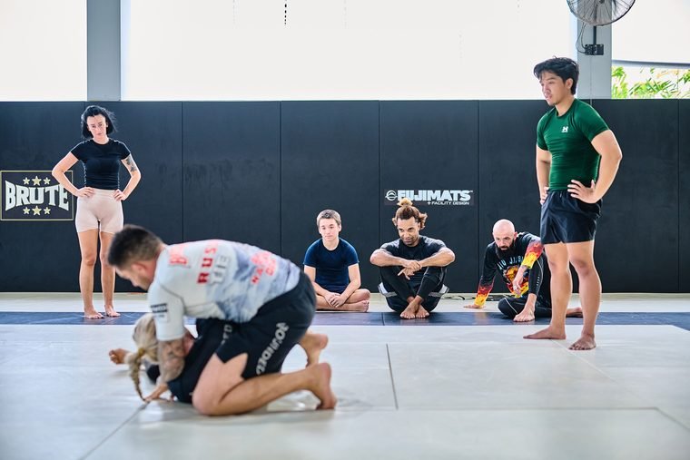 Students of all levels watching a No-Gi demonstration in the dojo at Superpro Samui
